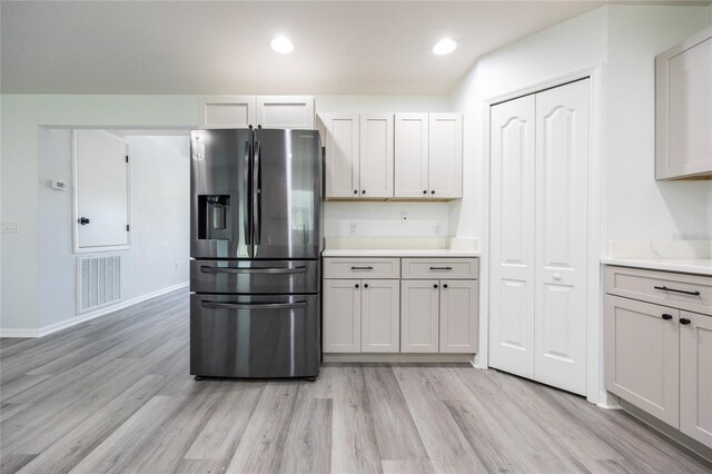 14384 NW 160th Ln, Alachua, FL 32615 - kitchen featuring stainless steel fridge, light wood-style flooring, light countertops, baseboards, and recessed lighting
