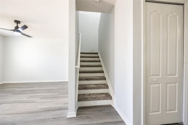 14384 NW 160th Ln, Alachua, FL 32615 - stairway featuring a ceiling fan, wood finished floors, and baseboards