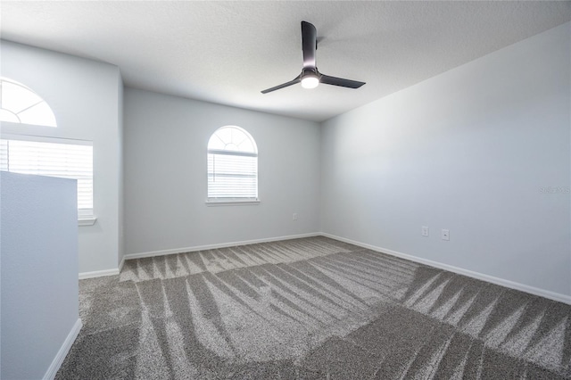 14384 NW 160th Ln, Alachua, FL 32615 - empty room featuring carpet floors, a ceiling fan, and baseboards