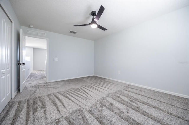 14384 NW 160th Ln, Alachua, FL 32615 - spare room with carpet flooring, a ceiling fan, and baseboards