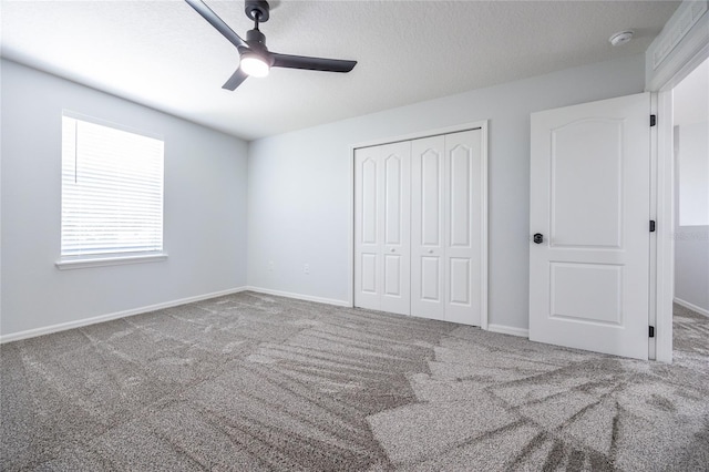 14384 NW 160th Ln, Alachua, FL 32615 - unfurnished bedroom featuring a closet, carpet floors, ceiling fan, and baseboards