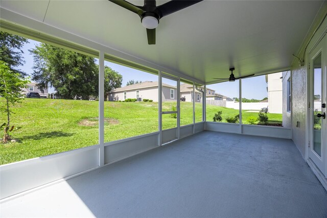 14384 NW 160th Ln, Alachua, FL 32615 - unfurnished sunroom with ceiling fan and a residential view