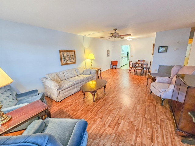 2850 59th St S Unit 310, Gulfport, FL 33707 - living room with light wood-type flooring and a ceiling fan