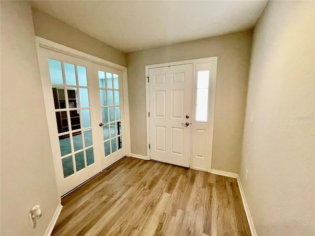 6376 SW 117th Street Rd, Ocala, FL 34476 - foyer entrance with french doors, baseboards, and wood finished floors