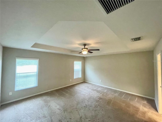 6376 SW 117th Street Rd, Ocala, FL 34476 - carpeted empty room with baseboards, a tray ceiling, and a ceiling fan