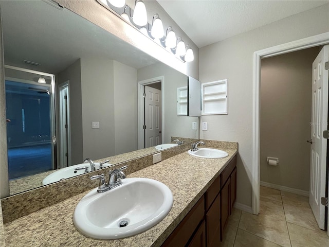 6376 SW 117th Street Rd, Ocala, FL 34476 - full bathroom featuring double vanity, tile patterned flooring, and baseboards