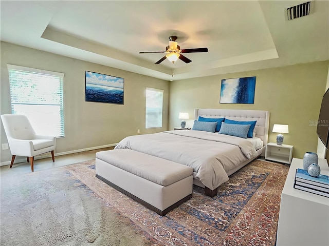 6376 SW 117th Street Rd, Ocala, FL 34476 - carpeted bedroom with a tray ceiling and ceiling fan