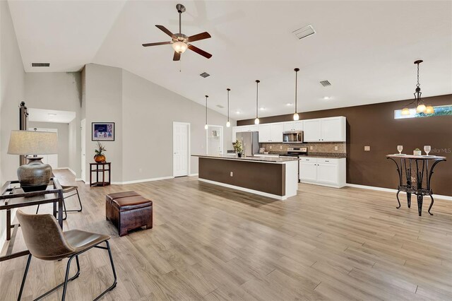 6376 SW 117th Street Rd, Ocala, FL 34476 - living room with a ceiling fan, light wood-type flooring, and high vaulted ceiling