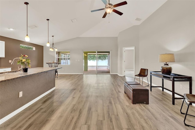 6376 SW 117th Street Rd, Ocala, FL 34476 - living room featuring ceiling fan, high vaulted ceiling, and light wood-style flooring