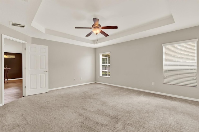 6376 SW 117th Street Rd, Ocala, FL 34476 - empty room featuring a raised ceiling, carpet floors, and a ceiling fan