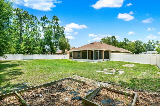 6376 SW 117th Street Rd, Ocala, FL 34476 - fenced backyard with a garden and a sunroom