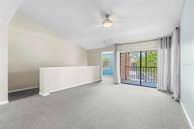 10511 Waterview Ct Unit 10511, Tampa, FL 33615 - carpeted empty room with a textured ceiling, vaulted ceiling, a ceiling fan, and baseboards