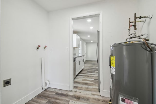 utility room with electric water heater