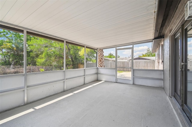unfurnished sunroom featuring plenty of natural light