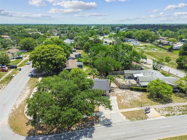 aerial perspective of suburban area with a tree filled landscape