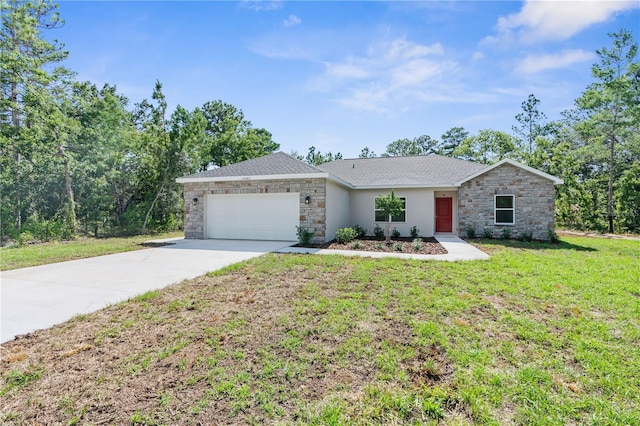 16247 Little Auk Rd, Weeki Wachee, FL 34614 - ranch-style house with stone siding, driveway, an attached garage, and a front lawn