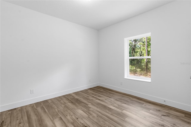 16247 Little Auk Rd, Weeki Wachee, FL 34614 - unfurnished room featuring wood finished floors and baseboards