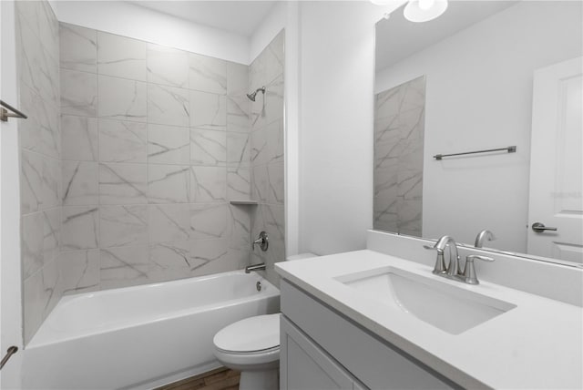 16247 Little Auk Rd, Weeki Wachee, FL 34614 - bathroom featuring shower / bath combination, toilet, vanity, and wood finished floors
