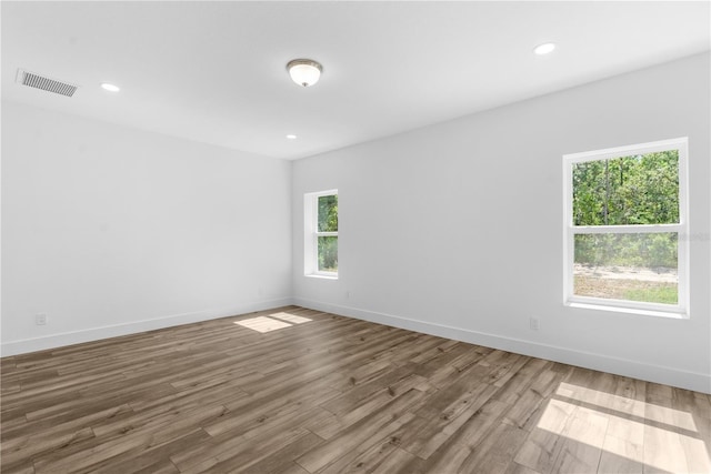 16247 Little Auk Rd, Weeki Wachee, FL 34614 - spare room featuring wood finished floors, baseboards, and recessed lighting
