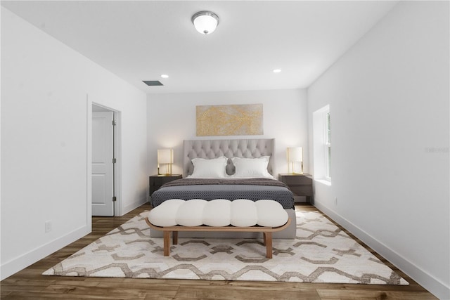 16247 Little Auk Rd, Weeki Wachee, FL 34614 - bedroom with wood finished floors, baseboards, and recessed lighting