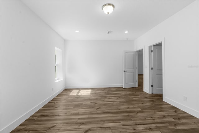 16247 Little Auk Rd, Weeki Wachee, FL 34614 - empty room with wood finished floors, baseboards, and recessed lighting