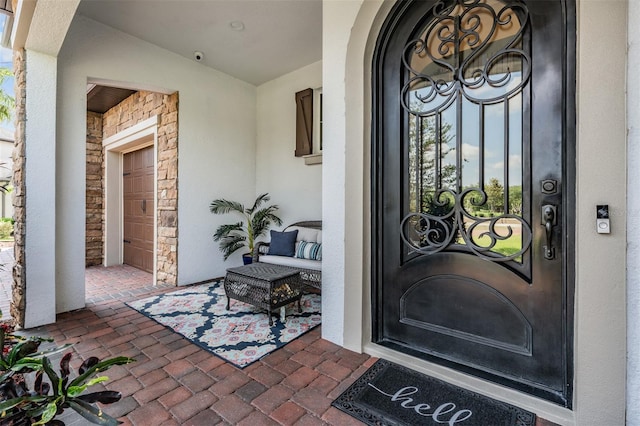 17724 Daisy Farm Dr, Lutz, FL 33559 - entrance to property featuring stucco siding, a surveillance system, and stone siding