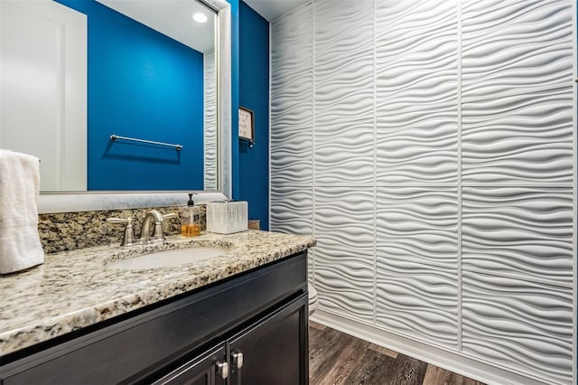17724 Daisy Farm Dr, Lutz, FL 33559 - bathroom featuring vanity, wood finished floors, and recessed lighting