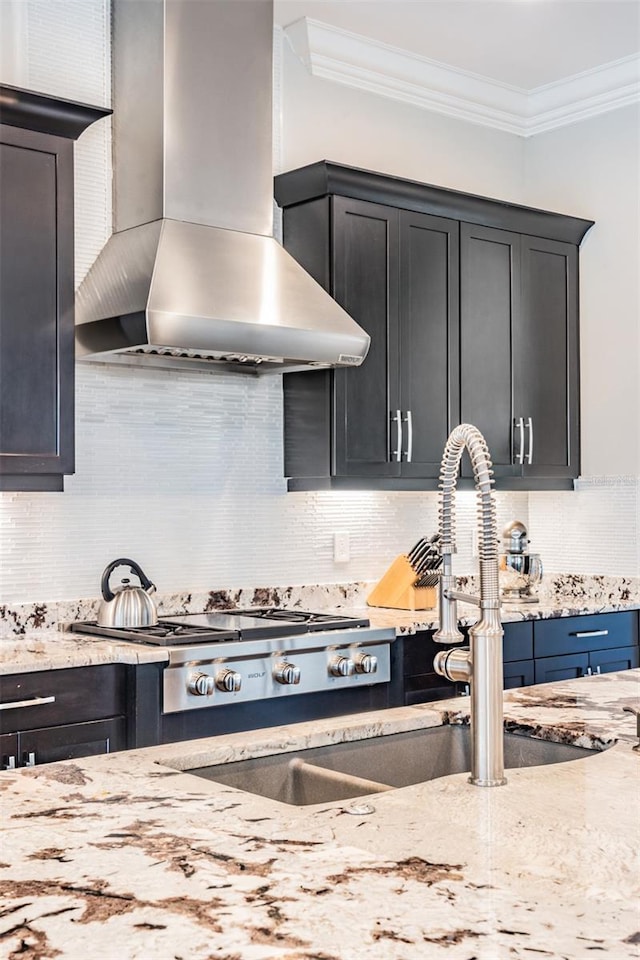 17724 Daisy Farm Dr, Lutz, FL 33559 - kitchen with wall chimney exhaust hood, ornamental molding, tasteful backsplash, and light stone countertops
