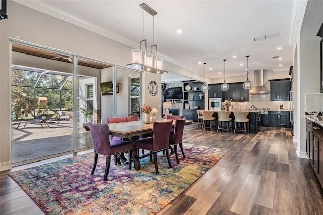 17724 Daisy Farm Dr, Lutz, FL 33559 - dining area featuring dark wood finished floors, ornamental molding, and recessed lighting