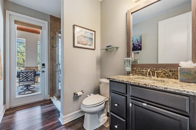 17724 Daisy Farm Dr, Lutz, FL 33559 - bathroom featuring vanity, wood finished floors, and a shower stall
