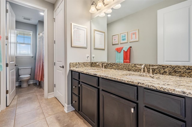 17724 Daisy Farm Dr, Lutz, FL 33559 - full bath featuring double vanity, tile patterned flooring, and a chandelier