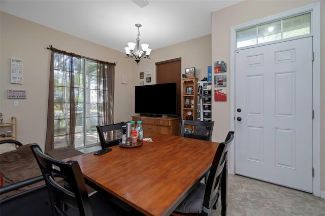 7001 Interbay Blvd Unit 242, Tampa, FL 33616 - dining space featuring a chandelier and plenty of natural light