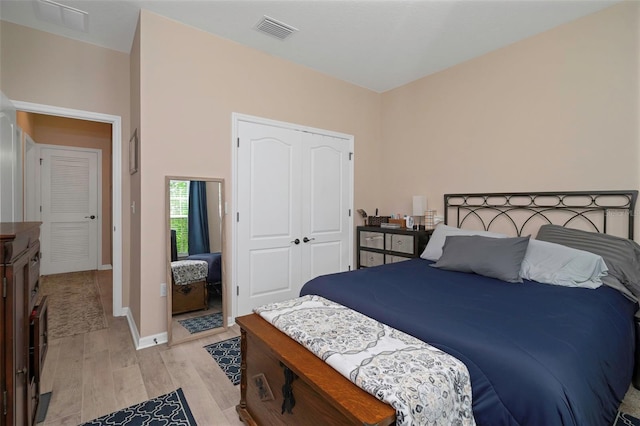 7001 Interbay Blvd Unit 242, Tampa, FL 33616 - bedroom featuring light wood-style floors, a closet, and baseboards