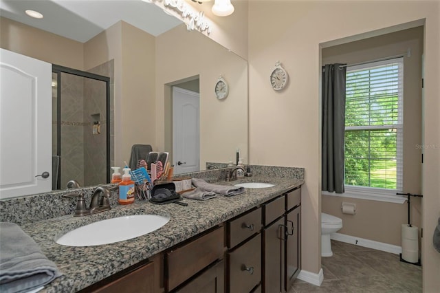 7001 Interbay Blvd Unit 242, Tampa, FL 33616 - bathroom with toilet, a stall shower, double vanity, and plenty of natural light