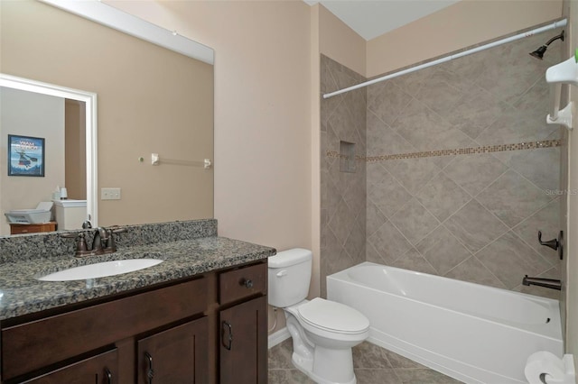 7001 Interbay Blvd Unit 242, Tampa, FL 33616 - bathroom featuring toilet, tile patterned floors, washtub / shower combination, and vanity