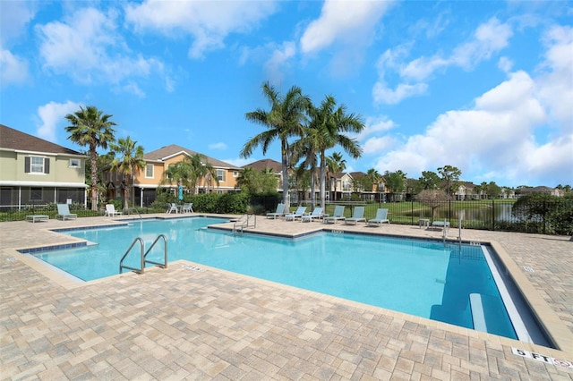 7001 Interbay Blvd Unit 242, Tampa, FL 33616 - community pool featuring a patio and a residential view