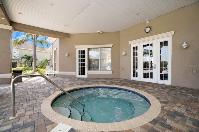 7001 Interbay Blvd Unit 242, Tampa, FL 33616 - view of pool with a hot tub, a patio area, french doors, and a swimming pool