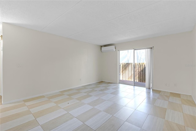 2820 Somerset Park Dr Unit 101, Tampa, FL 33613 - empty room with a wall mounted air conditioner, baseboards, and a textured ceiling