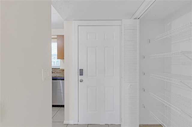 2820 Somerset Park Dr Unit 101, Tampa, FL 33613 - hallway with light tile patterned flooring and baseboards