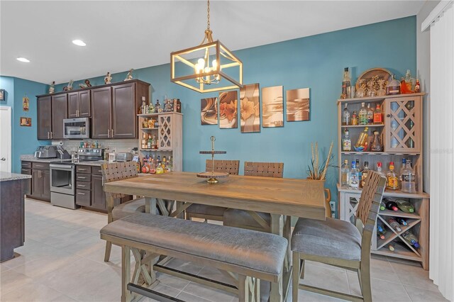11684 Brighton Knoll Loop, Riverview, FL 33579 - dining room with a chandelier, light tile patterned floors, and recessed lighting