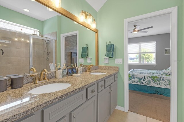 11684 Brighton Knoll Loop, Riverview, FL 33579 - full bath featuring double vanity, tile patterned floors, a stall shower, a ceiling fan, and baseboards