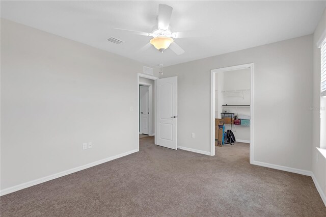 11684 Brighton Knoll Loop, Riverview, FL 33579 - unfurnished bedroom featuring carpet floors, a spacious closet, baseboards, and a closet