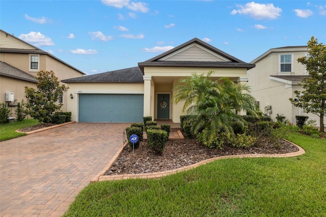 3972 Wisdom Trl, Land O Lakes, FL 34638 - single story home with decorative driveway, a garage, stucco siding, a front yard, and a shingled roof