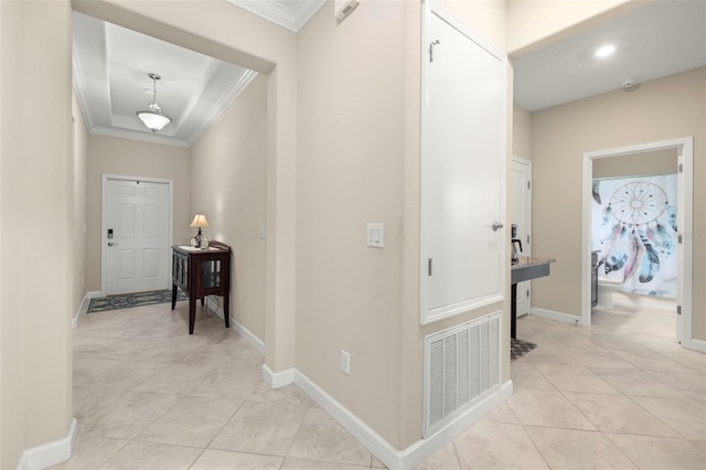 3972 Wisdom Trl, Land O Lakes, FL 34638 - hallway featuring ornamental molding, light tile patterned flooring, baseboards, and a tray ceiling
