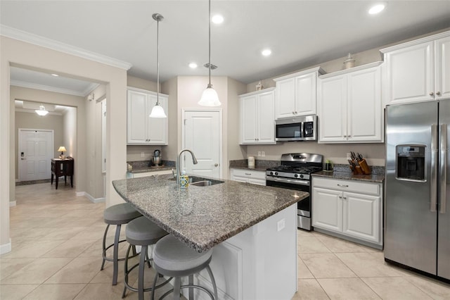 3972 Wisdom Trl, Land O Lakes, FL 34638 - kitchen with stainless steel appliances, a sink, light tile patterned flooring, white cabinetry, and recessed lighting