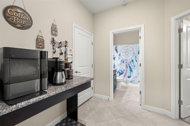 3972 Wisdom Trl, Land O Lakes, FL 34638 - full bathroom featuring baseboards, tile patterned flooring, toilet, and a shower with shower curtain