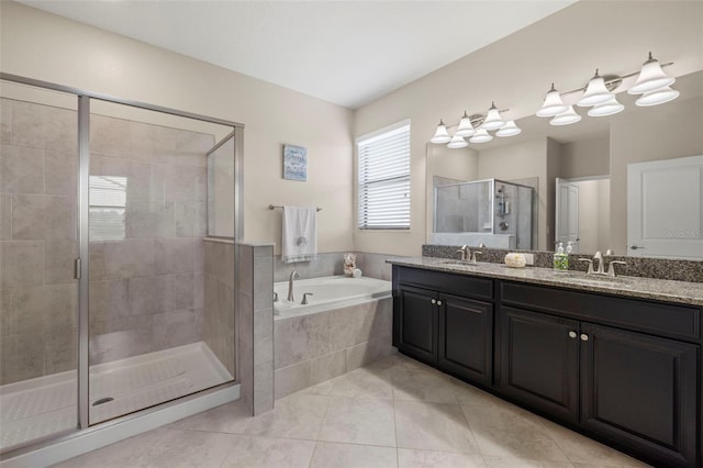 3972 Wisdom Trl, Land O Lakes, FL 34638 - bathroom featuring a bath, a stall shower, tile patterned floors, and double vanity