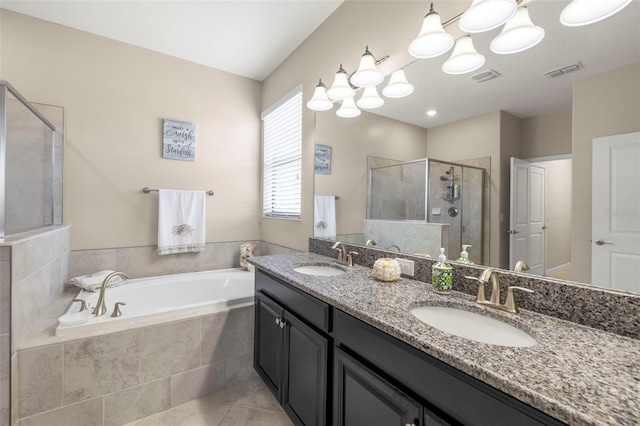 3972 Wisdom Trl, Land O Lakes, FL 34638 - bathroom featuring a bath, a shower stall, double vanity, and tile patterned flooring