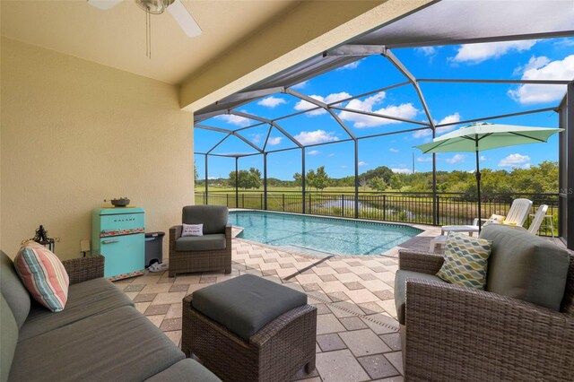 3972 Wisdom Trl, Land O Lakes, FL 34638 - view of swimming pool featuring ceiling fan, a patio area, and glass enclosure