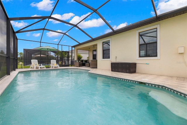 3972 Wisdom Trl, Land O Lakes, FL 34638 - outdoor pool with a patio area, an outdoor living space, and glass enclosure